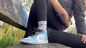 A Daring Blonde Indulges In Public Intimacy In A Park